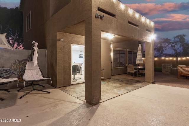 view of patio terrace at dusk