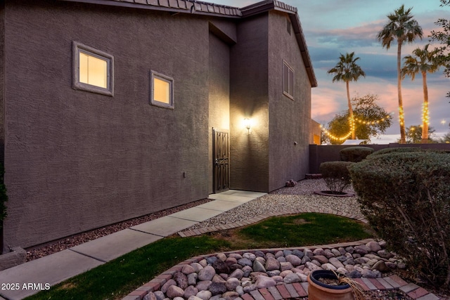 view of property exterior at dusk