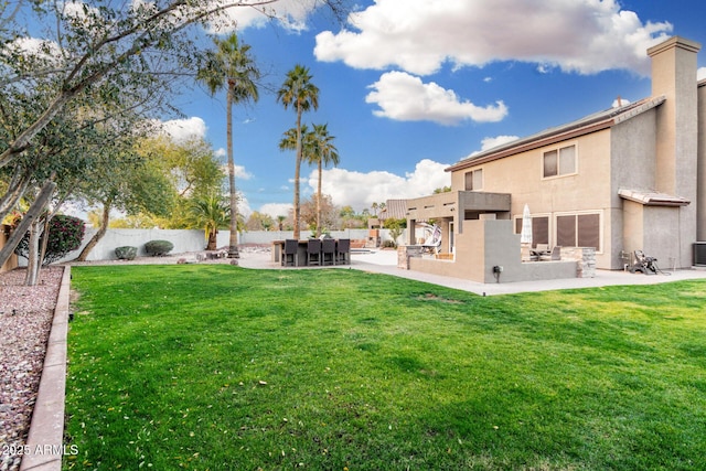 view of yard featuring central AC unit and a patio area