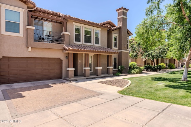 14250 W Wigwam Blvd Unit 121, Litchfield Park, AZ 85340 - mediterranean / spanish home featuring a tile roof, decorative driveway, a balcony, an attached garage, and stucco siding