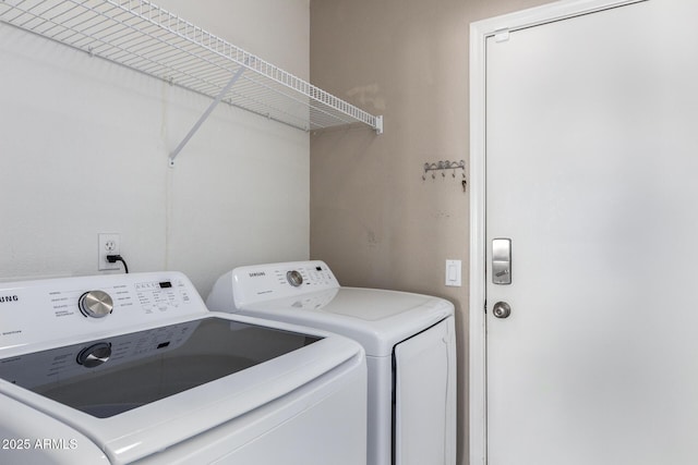 clothes washing area featuring washing machine and clothes dryer