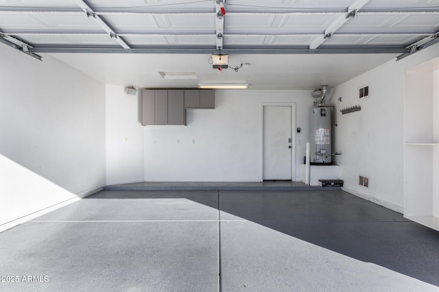 garage with a garage door opener and water heater