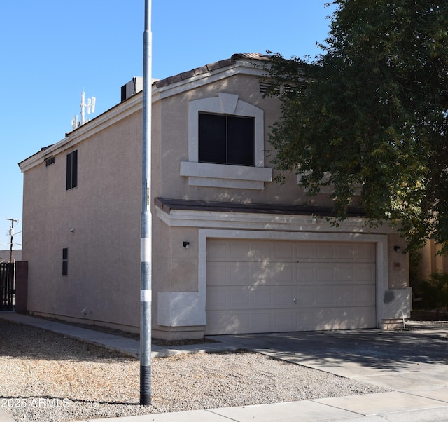 view of property exterior with a garage