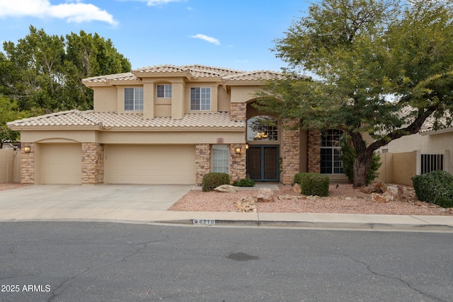 mediterranean / spanish-style home featuring a garage