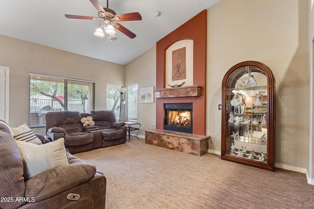 living room with carpet, ceiling fan, and high vaulted ceiling