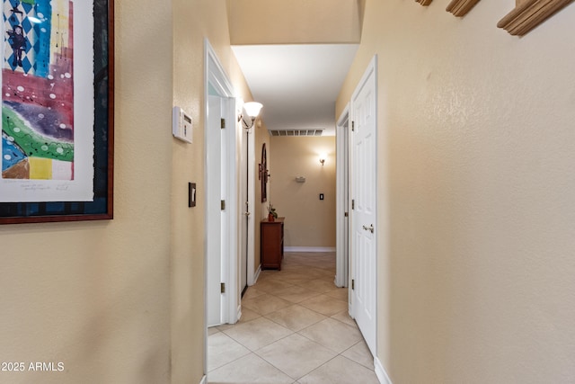 hallway featuring light tile patterned floors