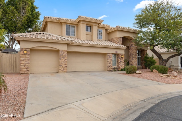 mediterranean / spanish home featuring a garage