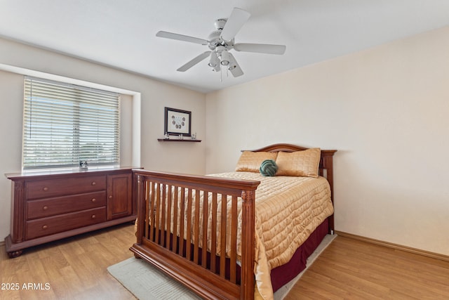 bedroom with ceiling fan and light wood-type flooring