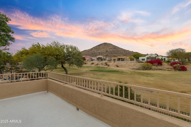 balcony at dusk with a mountain view