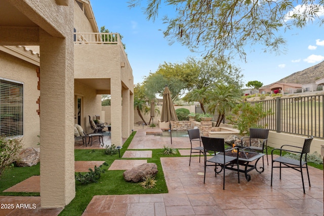 view of patio / terrace with an outdoor fire pit