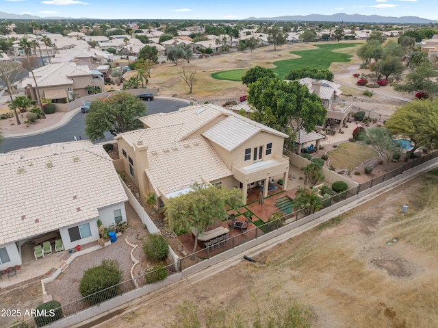 birds eye view of property with a mountain view