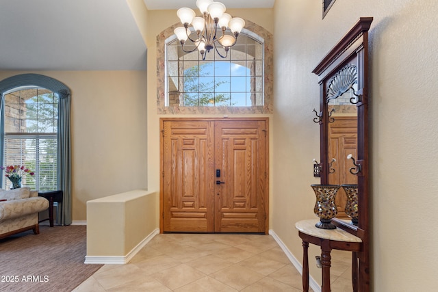 foyer featuring a chandelier