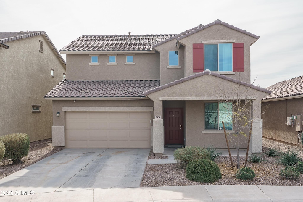 view of front of property featuring a garage