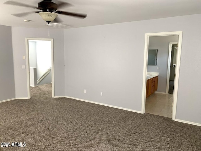 carpeted spare room with ceiling fan