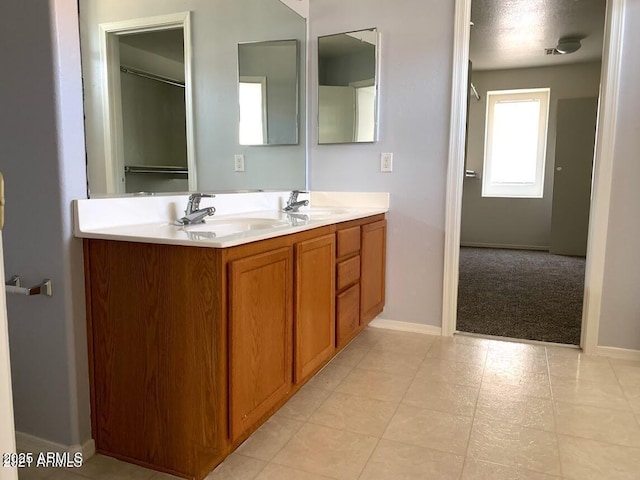 bathroom with vanity and a textured ceiling