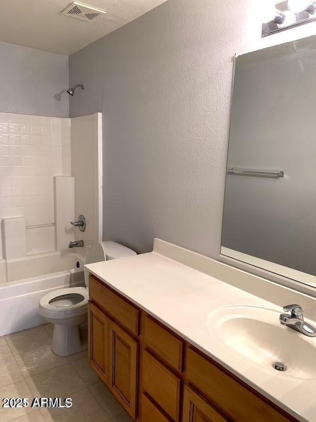 full bathroom featuring shower / bathtub combination, toilet, vanity, and tile patterned flooring