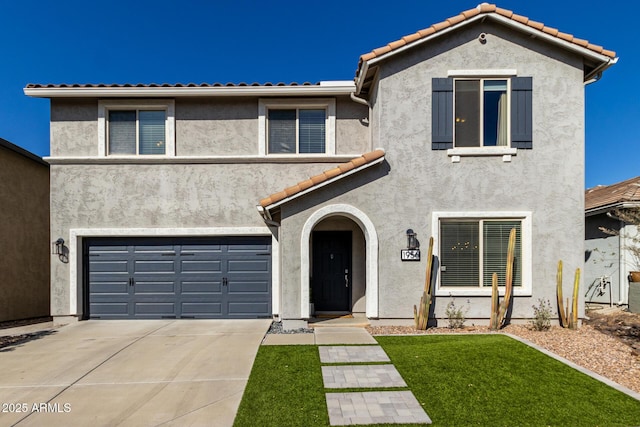 view of front of home with a garage and a front yard