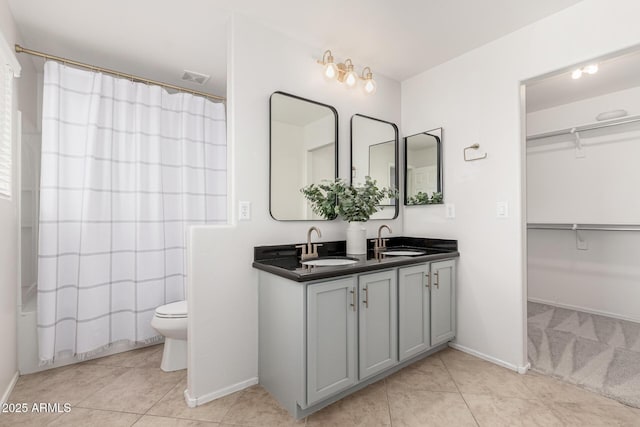 full bathroom with vanity, tile patterned floors, toilet, and shower / bathtub combination with curtain