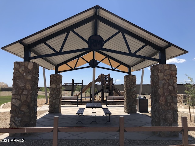 surrounding community featuring a gazebo and a playground