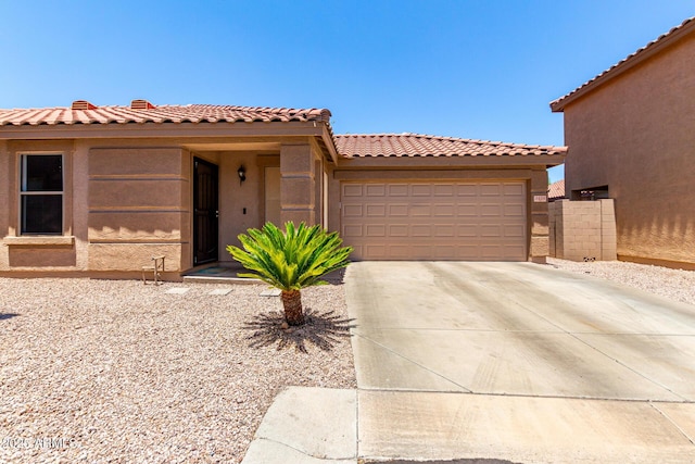 3438 S Bowman Rd, Apache Junction, AZ 85119 - view of front facade with stucco siding, an attached garage, driveway, and a tile roof