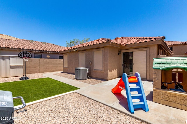 3438 S Bowman Rd, Apache Junction, AZ 85119 - back of house featuring a fenced backyard, stucco siding, a patio area, and a tile roof