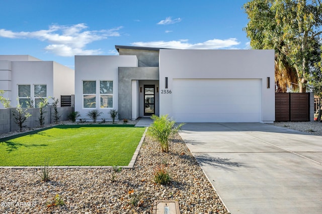 modern home with a garage and a front lawn