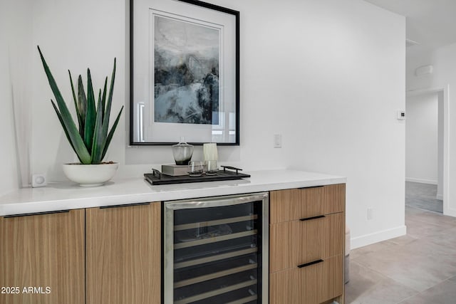 bar featuring light tile patterned floors and wine cooler