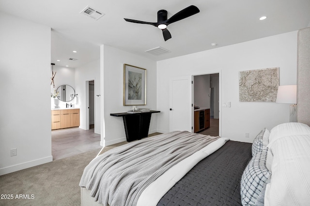 carpeted bedroom featuring ceiling fan, sink, and connected bathroom