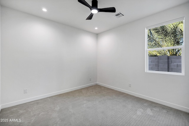 carpeted empty room with ceiling fan