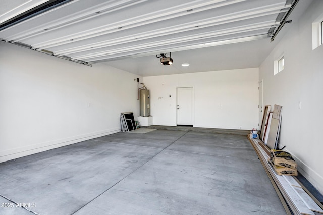 garage featuring water heater and a garage door opener