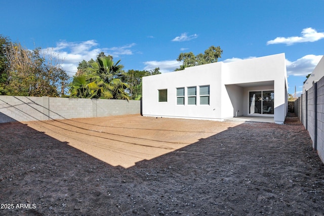 back of property featuring a patio area