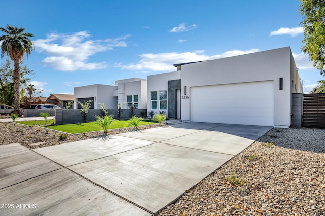 modern home with a garage and a front lawn