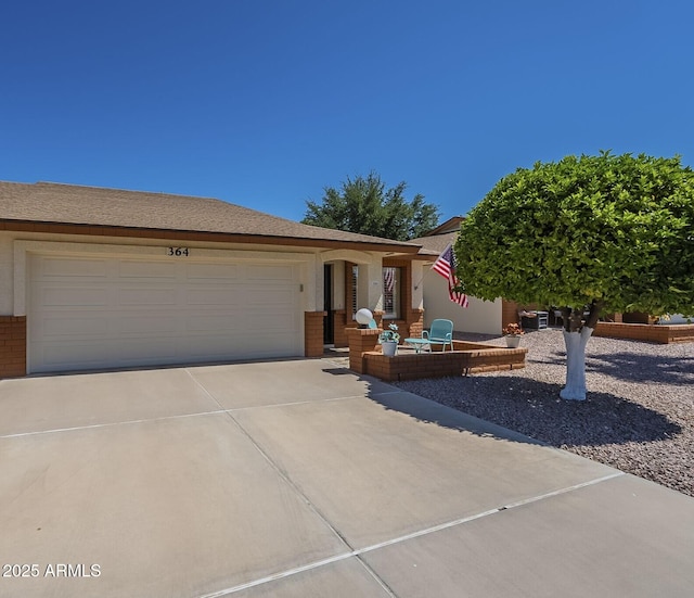 8160 E Keats Ave Unit 364, Mesa, AZ 85209 - view of front facade with brick siding, an attached garage, and concrete driveway