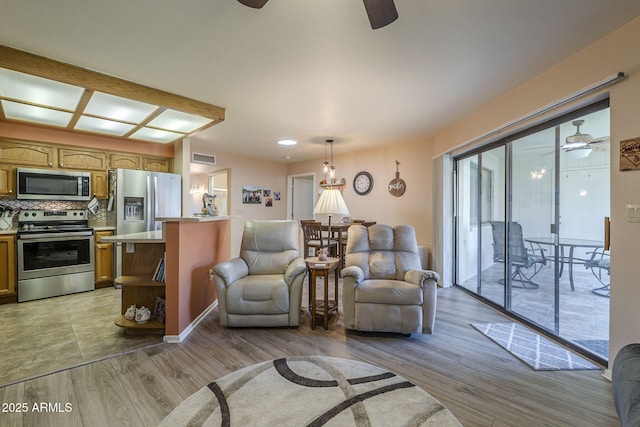 8160 E Keats Ave Unit 364, Mesa, AZ 85209 - living area with a ceiling fan and light wood-type flooring