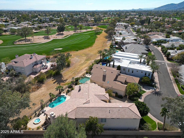 drone / aerial view featuring a residential view and view of golf course