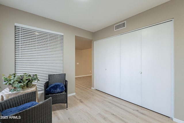 sitting room with light hardwood / wood-style floors