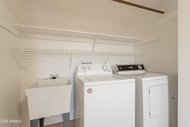 laundry room with sink and independent washer and dryer