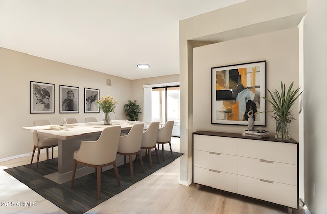 dining space featuring light wood-type flooring
