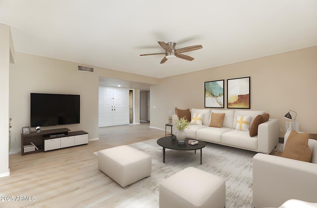 living room featuring ceiling fan and light hardwood / wood-style flooring