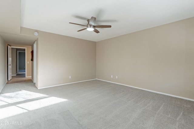 empty room with light carpet and ceiling fan
