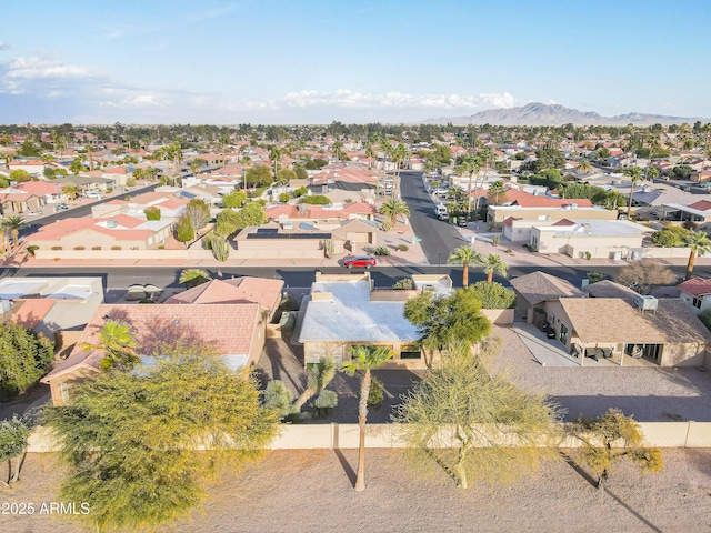 birds eye view of property with a mountain view