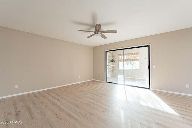 spare room featuring ceiling fan and light wood-type flooring