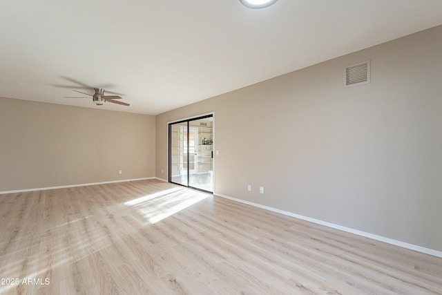 empty room with ceiling fan and light wood-type flooring