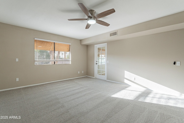 carpeted empty room with ceiling fan