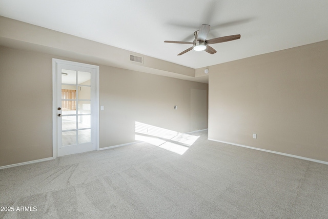 carpeted empty room featuring ceiling fan