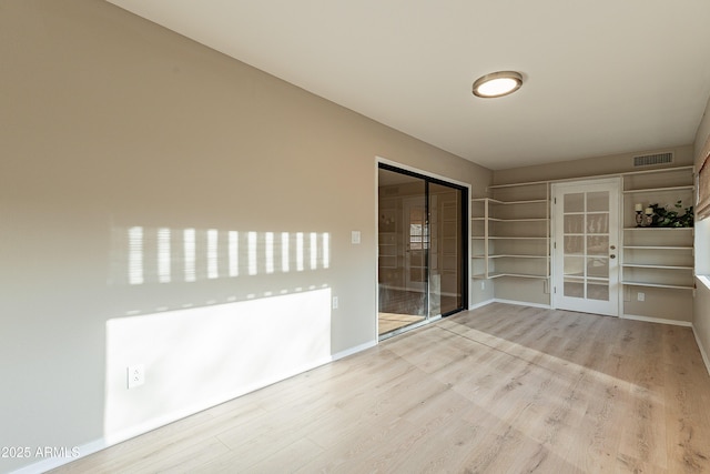 spare room featuring light hardwood / wood-style flooring