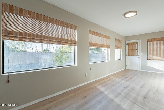 spare room with light hardwood / wood-style floors