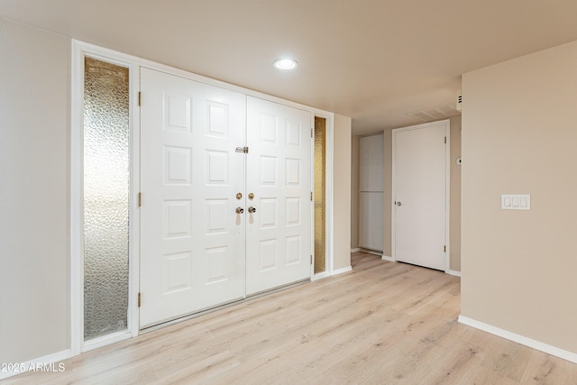 entrance foyer with light hardwood / wood-style flooring