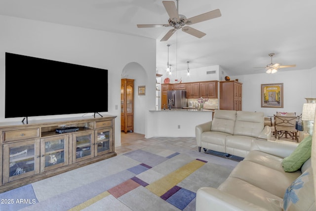 living room with vaulted ceiling and ceiling fan