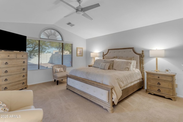 carpeted bedroom with vaulted ceiling and ceiling fan